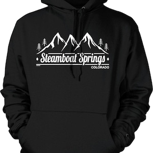 May include: Black hooded sweatshirt with a white graphic of mountain peaks and trees. The text "Steamboat Springs Colorado" is printed below the mountain graphic. The sweatshirt has a front pocket and a drawstring hood.