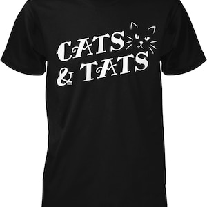 May include: Black t-shirt with white text that reads "Cats & Tats" with a stylized cat face above the word "Cats".