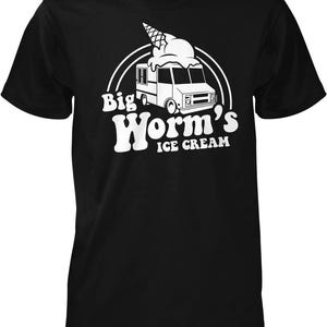 May include: Black t-shirt with a white graphic of an ice cream truck and the text "Big Worm's Ice Cream". The ice cream truck has a large ice cream cone on top.