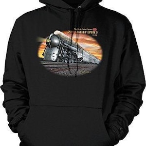 May include: A black hooded sweatshirt featuring a graphic print of the 20th Century Limited steam locomotive on the front. The train is depicted in a sunset scene with the text New York Central System 20th Century Limited 1938 above it.