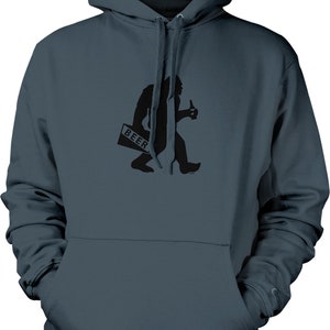 May include: A navy blue hooded sweatshirt with a black graphic of Bigfoot holding a beer bottle and a sign that says "BEER". The sweatshirt has a front pocket and a drawstring hood.
