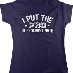 A navy blue t-shirt with the text "I PUT THE PRO IN PROCRASTINATE" printed on it.