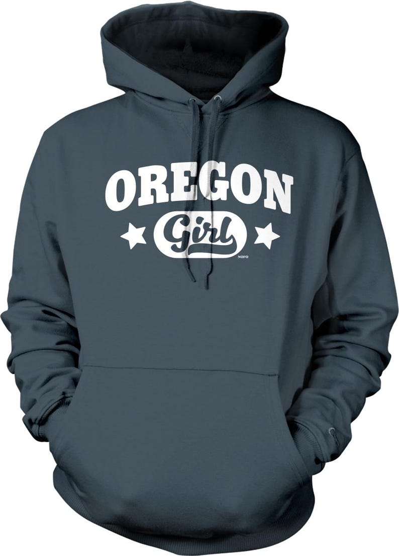 A dark grey hoodie with the text "OREGON GIRL" printed on it in white.