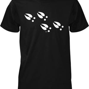 A black t-shirt with a graphic design of white animal hoof prints.