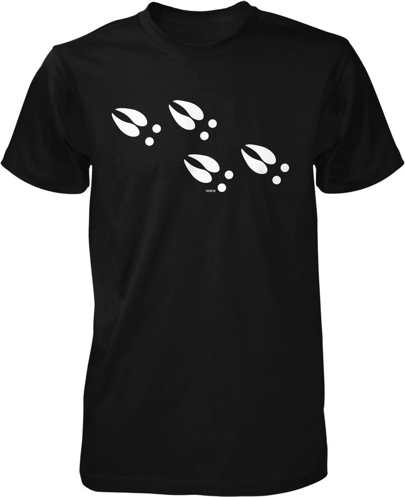 A black t-shirt with a graphic design of white animal hoof prints.