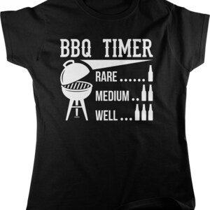 May include: Black t-shirt with a white graphic. The graphic reads "BBQ TIMER" above an illustration of a grill. Below the grill are the words "RARE", "MEDIUM", and "WELL", each with a corresponding number of bottle illustrations.