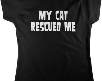 May include: A black short-sleeved t-shirt featuring the white text "MY CAT RESCUED ME" printed in a bold, sans-serif font across the chest, with the small white text "NOFO" positioned below the word "ME" on the right side.
