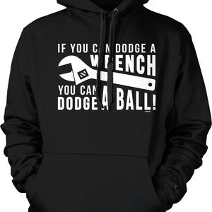 May include: Black hooded sweatshirt with a white graphic. The graphic features a wrench and the text: "IF YOU CAN DODGE A WRENCH YOU CAN DODGE A BALL!"