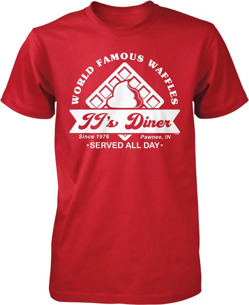 A red t-shirt with a graphic design featuring a waffle and the text "It's Diner" and "World Famous Waffles".