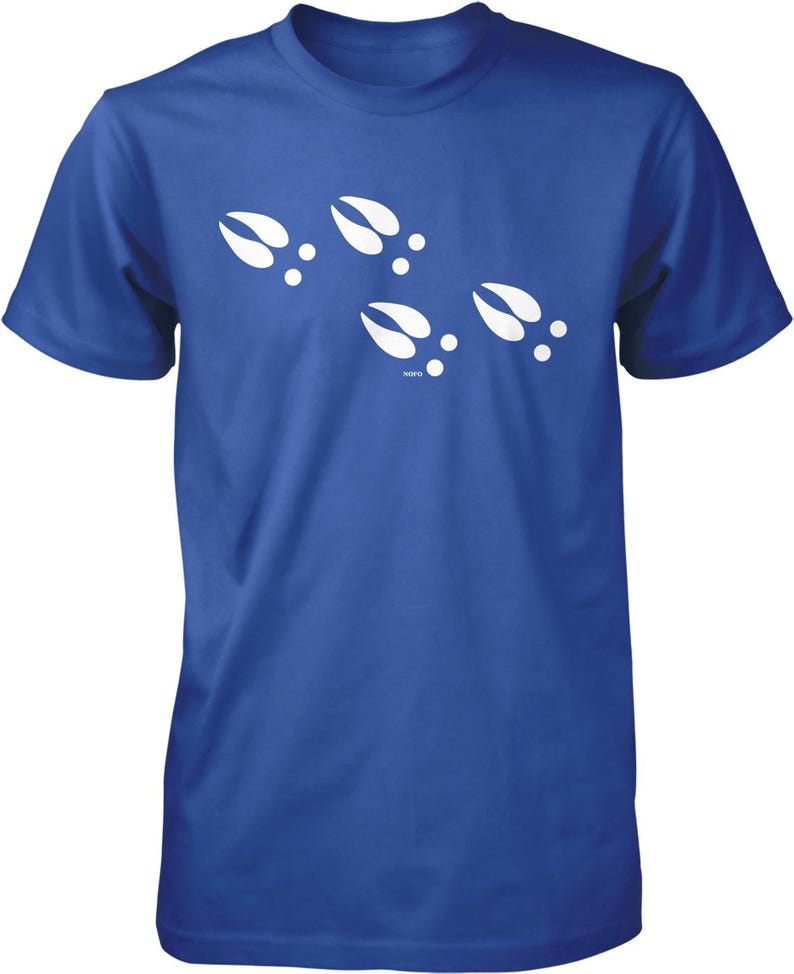 A blue t-shirt with white paw prints printed on it.