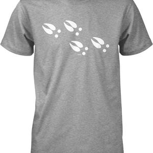 A gray t-shirt with a graphic design of white paw prints.