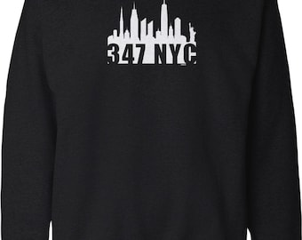May include: A black long-sleeve sweatshirt featuring a white graphic print of the New York City skyline, including the Statue of Liberty, positioned above the bold white text 347 NYC centered on the chest area of the garment.