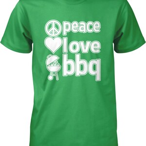 A green t-shirt with white text that says "Peace I love BBQ".