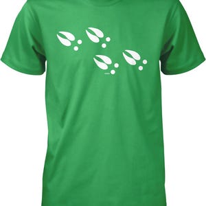 A green t-shirt with white paw prints printed on it.