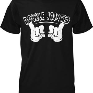 A black t-shirt with a white graphic design that says "DOUBLE JOINED" in a playful, cartoon-like font.