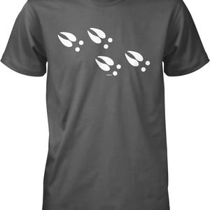 A gray t-shirt with a graphic design of white animal hoof prints.