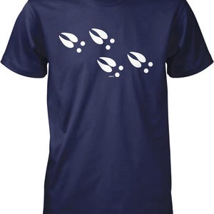 A navy blue t-shirt with white paw prints printed on it.