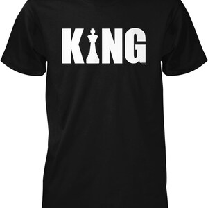 A black t-shirt with the word "KING" printed in white letters.