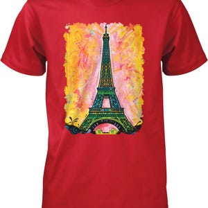 A red t-shirt with a colorful painting of the Eiffel Tower in the center.