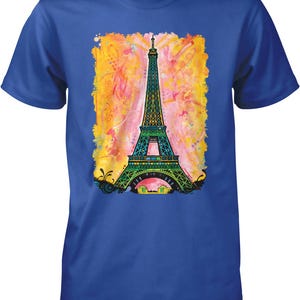 A blue t-shirt with a colorful painting of the Eiffel Tower in the center.