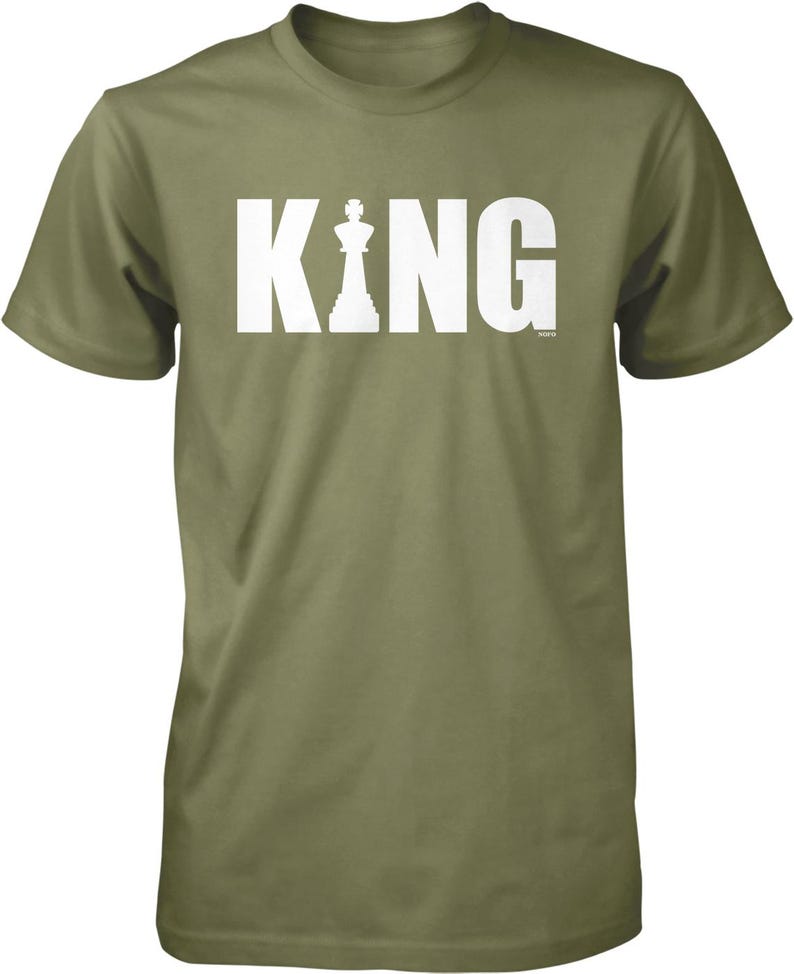 A green t-shirt with the word "KING" printed in white letters.