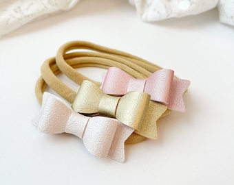 Baby bows, Vegan Leather Mini Bows, set of 3 Handmade, Baby headbands, nylon headband, pearly pink, gold, pearly white. 2 inches