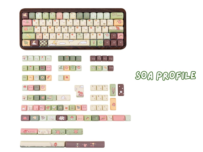 May include: A keyboard with a wooden frame and a variety of colourful keycaps. The keycaps feature pastel colours and cute illustrations of animals, plants, and patterns. Additional keycaps are displayed below the keyboard.