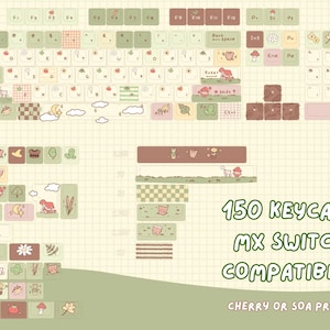 May include: A set of 150 keycaps with a cute, whimsical design. The keycaps feature a variety of pastel colours, including green, pink, and brown, with illustrated icons. The text "150 KEYCAPS MX SWITCH COMPATIBLE" is visible.