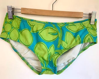 Vintage 1960s or 1970s low-rise bathing suit bottom, green and blue leaf pattern, size XS