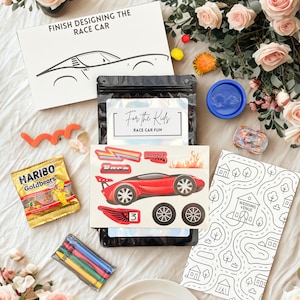 May include: A race car-themed activity kit with a red race car sticker, crayons, and a coloring sheet. The kit includes a bag of Haribo Goldbears and a box that says "FINISH DESIGNING THE RACE CAR".