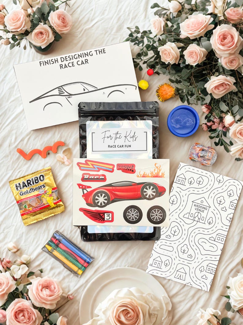 May include: A race car-themed activity kit with a red race car sticker, crayons, and a coloring sheet. The kit includes a bag of Haribo Goldbears and a box that says "FINISH DESIGNING THE RACE CAR".