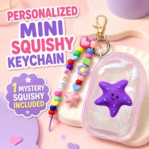 May include: A clear, oval-shaped pouch containing a purple starfish squishy with blue dots. Attached is a gold-tone lobster clasp keychain featuring two strands of colorful plastic beads, including heart, flower, and star shapes, with the name MAXI.