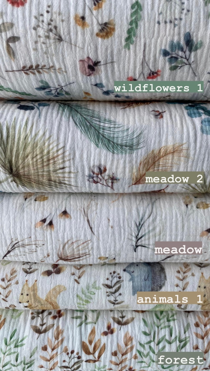 May include: Four different fabric swatches with various nature-inspired prints. The top swatch features a white background with small, colorful wildflowers. The second swatch has a white background with green and brown leafy patterns. The third swatch has a white background with small brown and white floral patterns. The bottom swatch has a white background with small brown and green floral patterns and a small brown squirrel and a gray hedgehog.