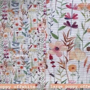 May include: Off-white fabric with a watercolour floral design. The pattern includes pink, orange, and yellow flowers, and green leaves. The text "poppy offwhite" and "large poppy offwhite" is visible.