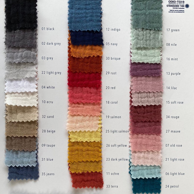 May include: A color chart of 35 fabric swatches, each with a different color and a corresponding number and name. The colors range from black to white, with shades of grey, blue, green, red, orange, yellow, brown, and pink. The chart is labeled "OEKO-TEX&reg; STANDARD 100".