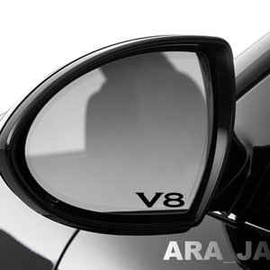 May include: Black side view mirror with a black V8 decal on the glass.