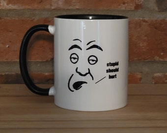 11 oz coffee mug with funny face and quote, stupid should hurt