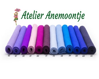 May include: A row of 10 felt fabric rolls in various shades of purple, blue, and light blue. The rolls are labeled with numbers 62, 61, 32, 31, 30, 71, 75, 58, 54, 59, 60, and 55.