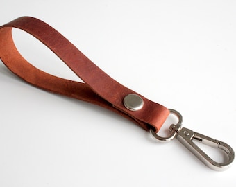 Leather wrist lanyard in cognac brown color with nickel hardware