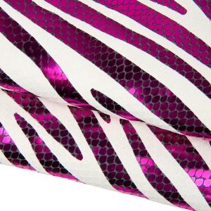 May include: Close-up of a textured white surface with diagonal, vibrant pink zebra stripes. The stripes have a metallic sheen and are outlined with a darker, scale-like pattern, creating a bold, eye-catching design. The overall aesthetic is modern and stylish.
