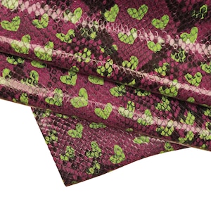 May include: Purple and green fabric with a snakeskin pattern and green hearts.