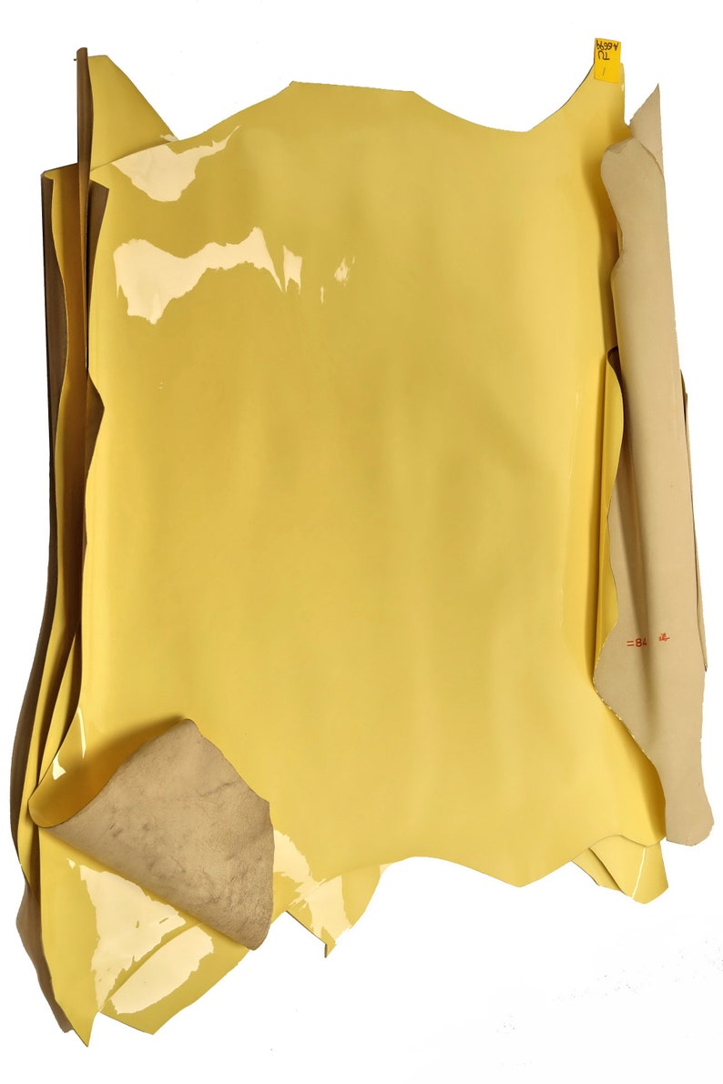 smooth pastel yellow patent hides size 27x31 inches slightly stiff skin A6699-TU La Garzarara Italian leather thickness 0.80.9 mm