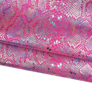 Pellame serpente OLEOGRAFICO su camoscio fuxia, pelle laminata iridescente stampa PITONE, capra metallizzata B17822-MT(st)  La Garzarara