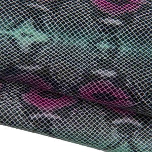 May include: A fabric swatch featuring a black and gray snakeskin-like grid pattern overlaid with scattered, vibrant pink and teal oval shapes. The material has a textured, slightly glossy finish with a repeating geometric scale design throughout.