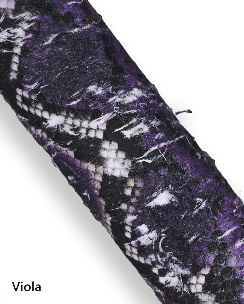 May include: Close-up of a rolled fabric with a snakeskin pattern in shades of purple, black, and white. The word "Viola" is printed at the bottom of the image.