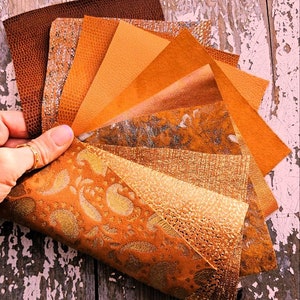 10 Ritagli di pellami unici selezionati nei toni dell' ARANCIO e CUOIO, pezzi di pelle assortimento mix fantasie come da foto RT202