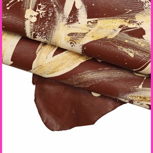 Pelle oro e BORDEAUX dipinta , nappa decorata a mano, pellame stampa schizzi panna e oro, semi lucida e morbida B16189-DM La Garzarara