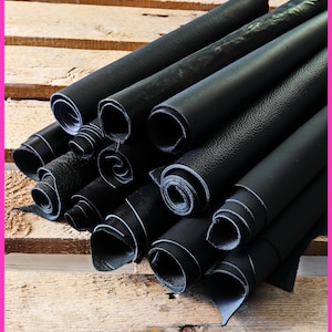 Ritagli di pelle color NERO, Assortimento casuale pezzi taglia media, lisci e stampati, rifinizioni varie 1 kg - 2 kg