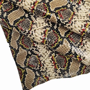 PELLE PITONATA, vitello stampa squametta e disegno pitone, lucido abbastanza morbido 3 combinazioni disponibili B13445-ST La Garzarara