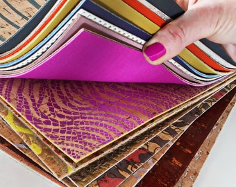 May include: A stack of colorful patterned cork sheets, some with a textured surface, are fanned out to reveal a bright pink sheet underneath.